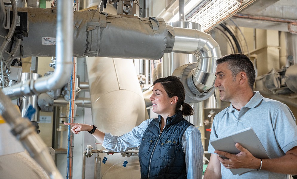 Two people in a feed factory