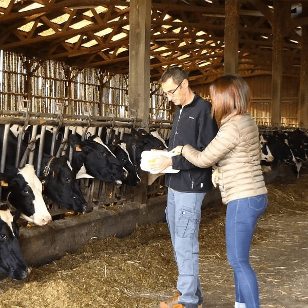 A Techna technician on a farm with his customer